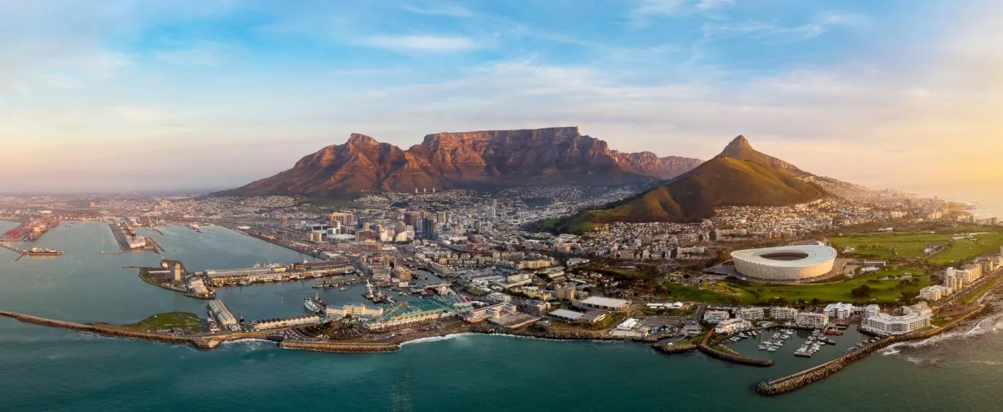 Aerial view of Cape Town at sunset with Table Mountain, Lion's Head and the harbour
